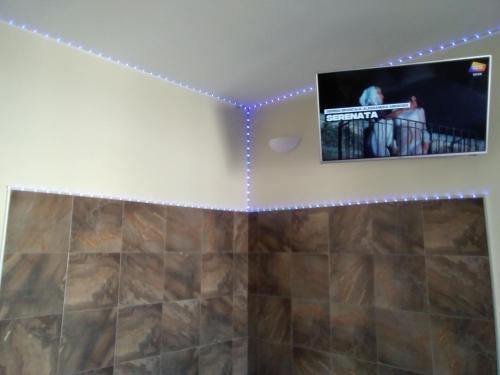 Televisyen dan/atau pusat hiburan di Palazzo dei Sogni Rooms Suite