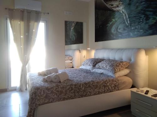 Katil atau katil-katil dalam bilik di Palazzo dei Sogni Rooms Suite