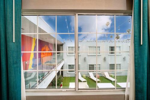 a view of a building through a window at The Kinney - Venice Beach in Los Angeles