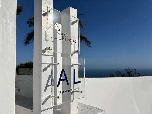 a sign for aaa on the side of a building at Casa Ribeiro in Funchal