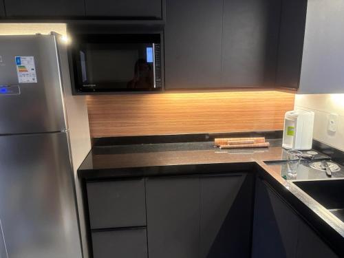 Dapur atau dapur kecil di Apartamento aconchegante em poços de caldas