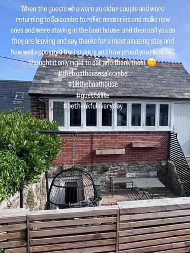 a picture of a house with a sign that reads when the guests who were at The Boathouse in Salcombe