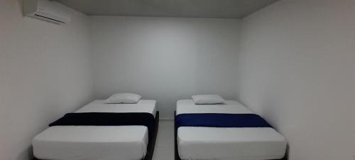 Postel nebo postele na pokoji v ubytování Hotel Roy