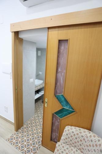 Ένα ή περισσότερα κρεβάτια σε δωμάτιο στο La casa dei lapilli, Pompei
