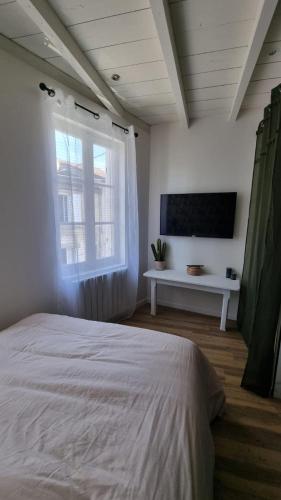 Gulta vai gultas numurā naktsmītnē Romantic Cognac Studio