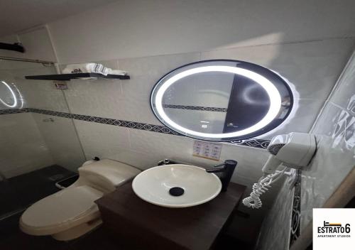 a bathroom with a sink and a mirror at Estrato6 Apart Studios in Villanueva