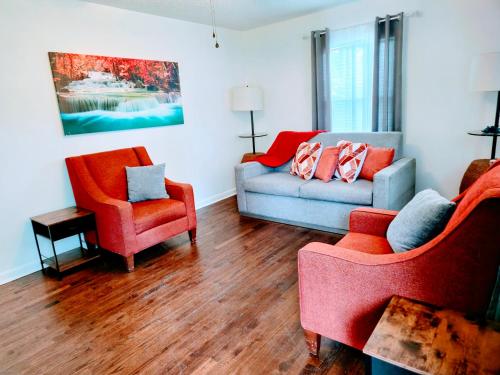 a living room with two chairs and a couch at 2 Bedroom Kitchen and Living Area in Fayetteville