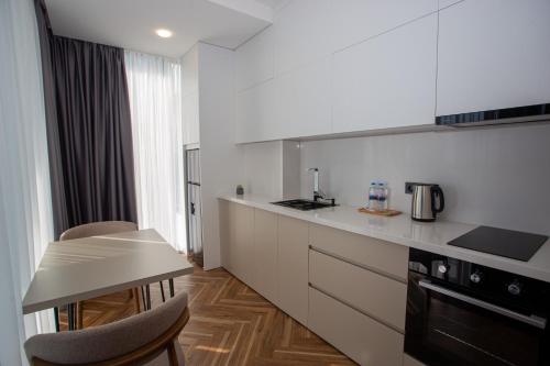 Kuchyň nebo kuchyňský kout v ubytování Paradise Apartments Solis Residence