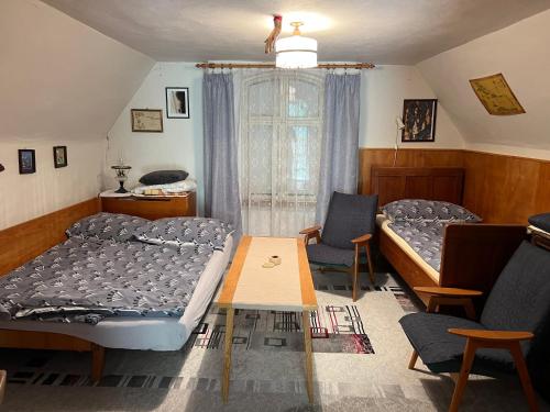 Postel nebo postele na pokoji v ubytování Vinný sklípek STARÝ VINAŘ