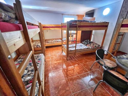 a room with four bunk beds in a room at Penzion Estetika in Jaroslavice