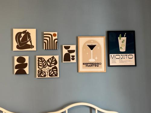 a group of pictures on a wall at Bentley Floriana Suites in Il-Furjana
