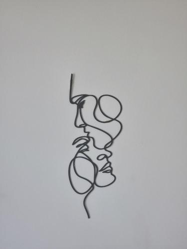 a black and white drawing of a face at Signature Villa à la Plage in Temara