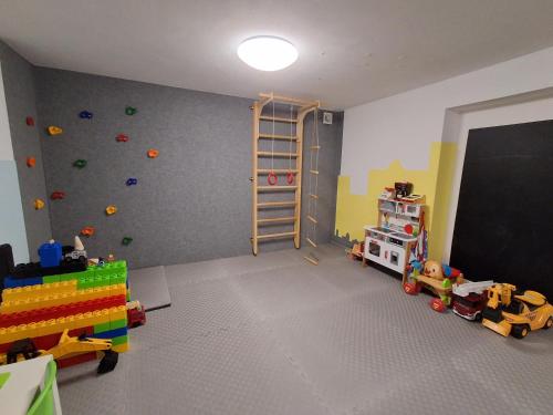 a room with a classroom with a ladder and a chalkboard at Ludna 27 in Niechorze