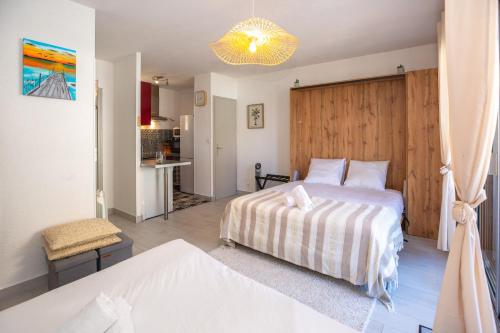 En eller flere senge i et værelse på Atlantic Selection - Studio Ivato, au Port de Capbreton