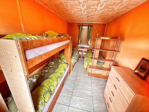 a room with two bunk beds in a house at Penzion Estetika in Jaroslavice