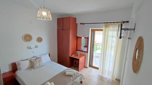 a living room with a couch and a window at Villa Christina Sea Side B in Hanioti