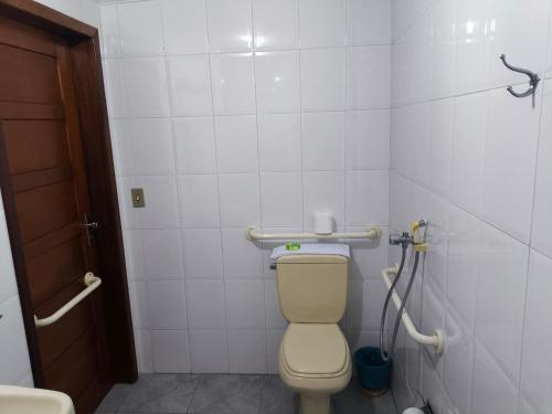 a bathroom with a toilet in a stall at Hotel Transcontinental in Ji-Paraná