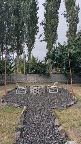 a group of benches sitting in a park at Soma Hotels Skardu in Skardu