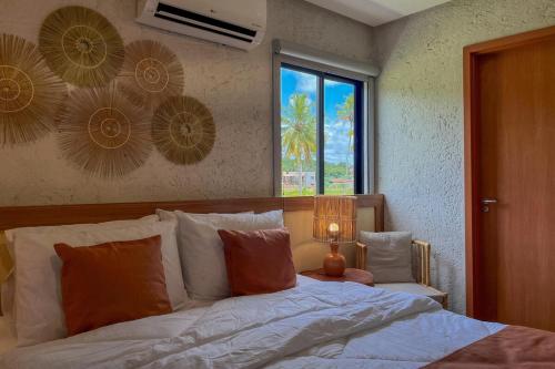 En eller flere senge i et værelse på Casa Sapê 14 - Milagres