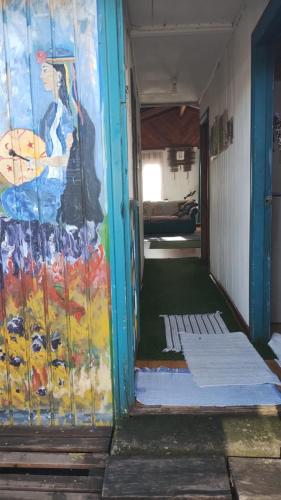 an empty room with a painting on the wall at Casa Minerva in Pucón