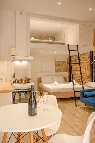 a living room with a bottle of wine on a table at Meli Studio in Corfu