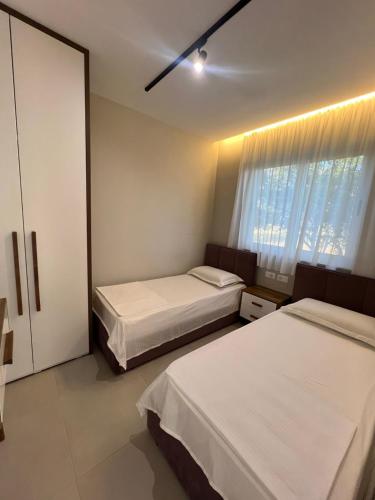 Postel nebo postele na pokoji v ubytování Lumière House