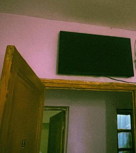 a sign on top of a mirror on a wall at Hotel afriquia in Oujda