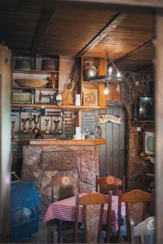 a room with a table and chairs in a room at Motel MOSKVA in Bijelo Polje