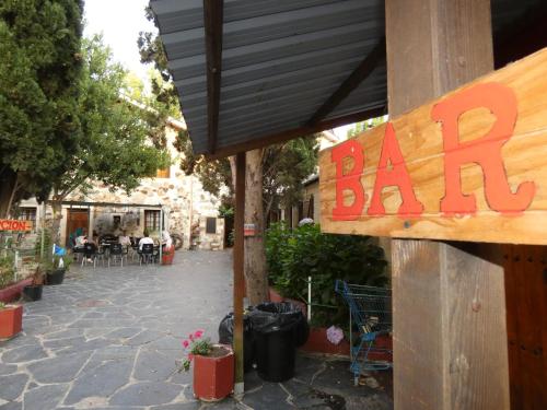 a bar sign on the side of a building at Hotel Rural Camino Medulas in Ponferrada