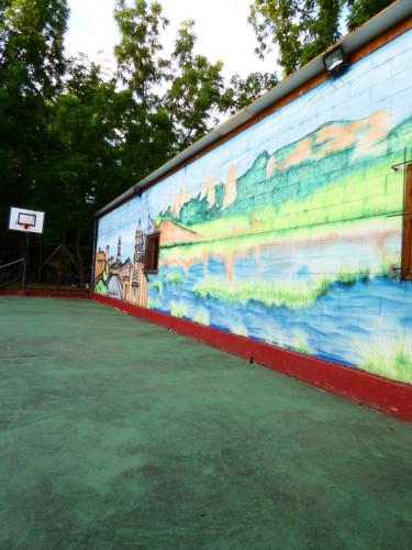 a mural on a wall with a basketball hoop at Hotel Rural Camino Medulas in Ponferrada