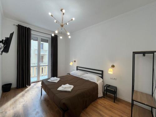 Кровать или кровати в номере Oriani Central Rooms