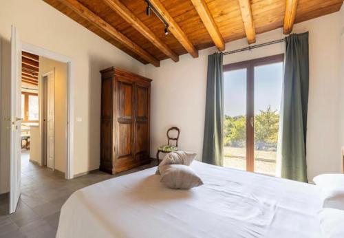 A bed or beds in a room at La Cantina Villa di campagna