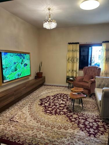 TV a/nebo společenská místnost v ubytování Dar Sayang 2