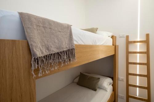 Postel nebo postele na pokoji v ubytování Al Capo Suite Home