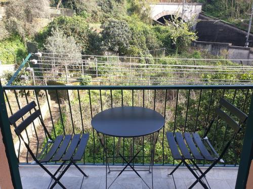 a table and chairs sitting on a balcony at Emilio House in Levanto