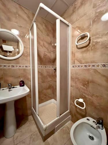 a bathroom with a shower and a toilet and a sink at La Caseta del Port in L'Ametlla de Mar