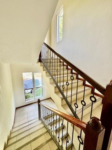 a staircase in a house with a window at Beach cozy Studio in Bain Boeuf