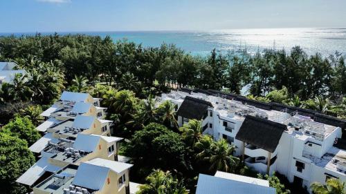 an aerial view of a resort near the ocean at Beach cozy Studio in Bain Boeuf