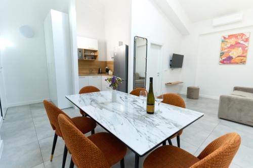 a dining room with a table and chairs at Lukas Apartments 3 in Zadar