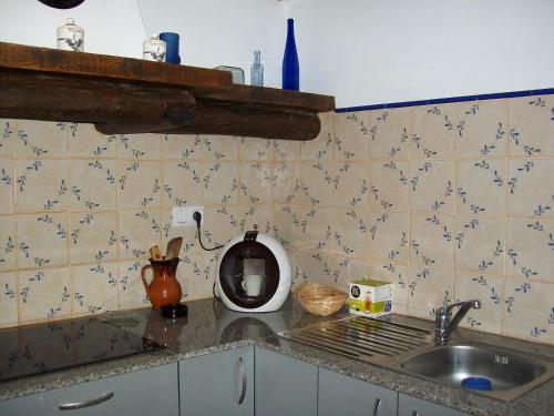 a kitchen with a sink and a counter top at Luna11 in Alcañiz