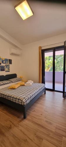 Кровать или кровати в номере Eraclea Minoa Apartments