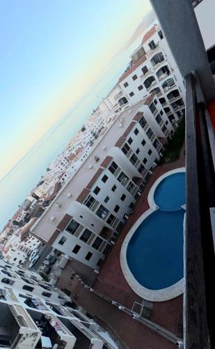 an aerial view of a hotel with a swimming pool at Appartement Oued Laou Mekkad in Oued Laou
