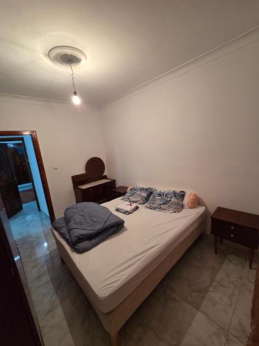 Una cama o camas en una habitación de Appartement calme