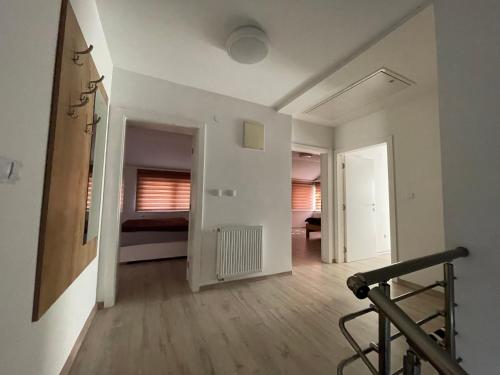 an empty room with a treadmill in a room at Aia Holiday Home in Sarajevo
