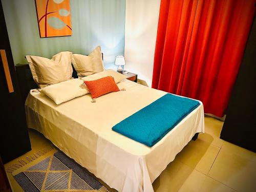 Un ou plusieurs lits dans un hébergement de l'établissement Flic en Flac Beachfront Apartment, KAZAFIBI