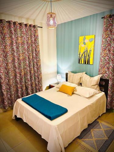 Un ou plusieurs lits dans un hébergement de l'établissement Flic en Flac Beachfront Apartment, KAZAFIBI