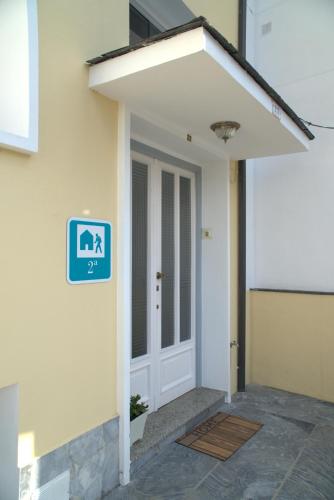 a door to a building with a sign on it at Albergue EL CASTILLO in Sarria