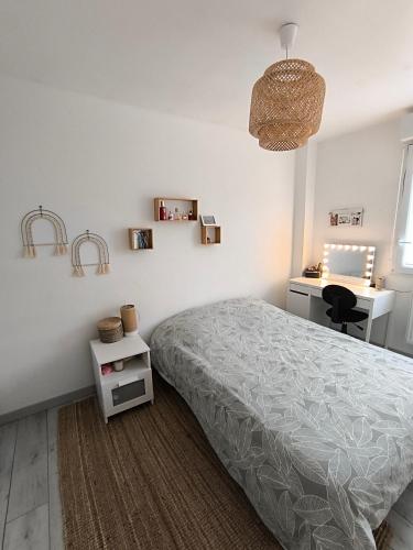 Ένα ή περισσότερα κρεβάτια σε δωμάτιο στο Maison 4 chambres
