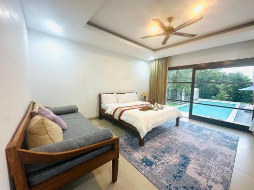 Ένα ή περισσότερα κρεβάτια σε δωμάτιο στο Makati Villa Tulamben