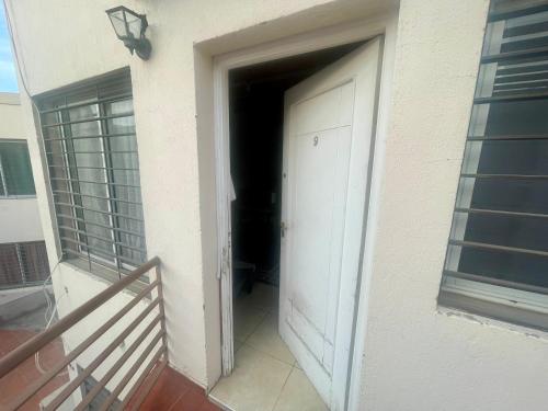 a door leading into a hallway on a building at Departamento a 5 minutos del Centro in Guaymallen